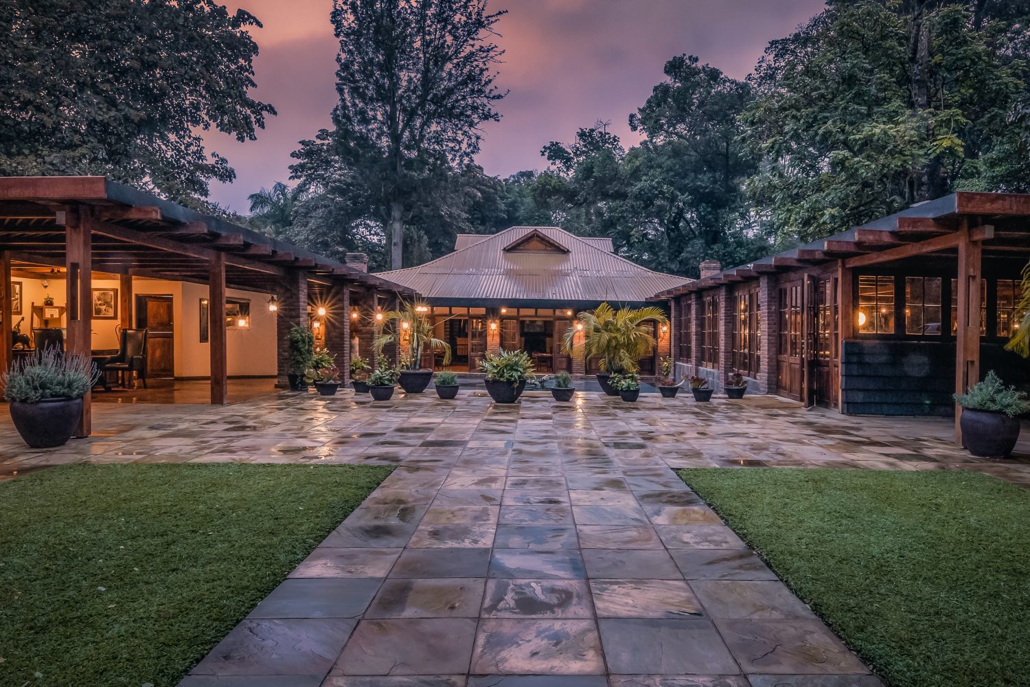 A beautifully designed suite at Arusha Coffee Lodge, nestled within a lush coffee plantation in Tanzania.